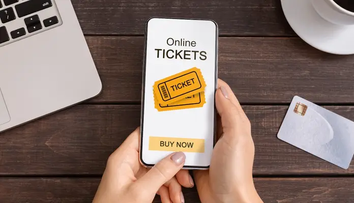 Someone buying tickets on their phone